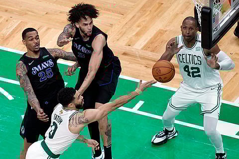 Jayson Tatum shoots against Dallas Mavericks